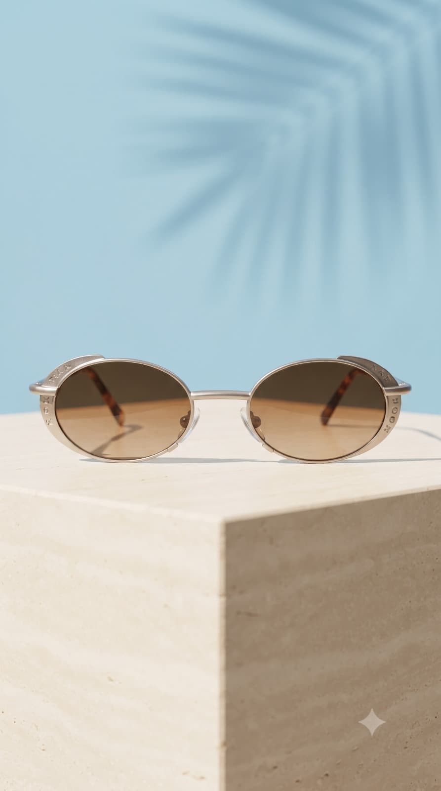 Archival silver eyewear presented in warm ivory light